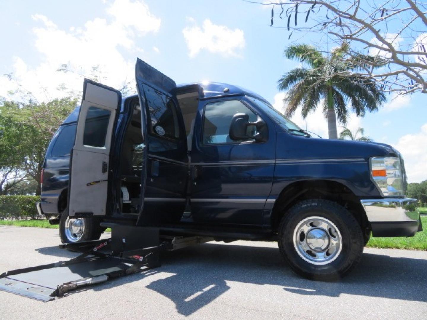 2011 Dark Blue /Gray Ford E-Series Wagon E-350 XLT Super Duty (1FBNE3BS4BD) with an 6.8L V10 SOHC 20V engine, located at 4301 Oak Circle #19, Boca Raton, FL, 33431, (954) 561-2499, 26.388861, -80.084038 - You are looking at a Gorgeous 2011 Ford Econoline E350 XLT Norcal Max High Top Handicap Wheelchair Conversion Van with 6.8L V10, 15K Original Miles, 9 Inch Lowered Floor, Braun UVL Side Entry Wheelchair Lift, Remote Control Power Side Entry Doors, Expanded Side Entry Doors, Q Straint Tie Down, Syste - Photo#1